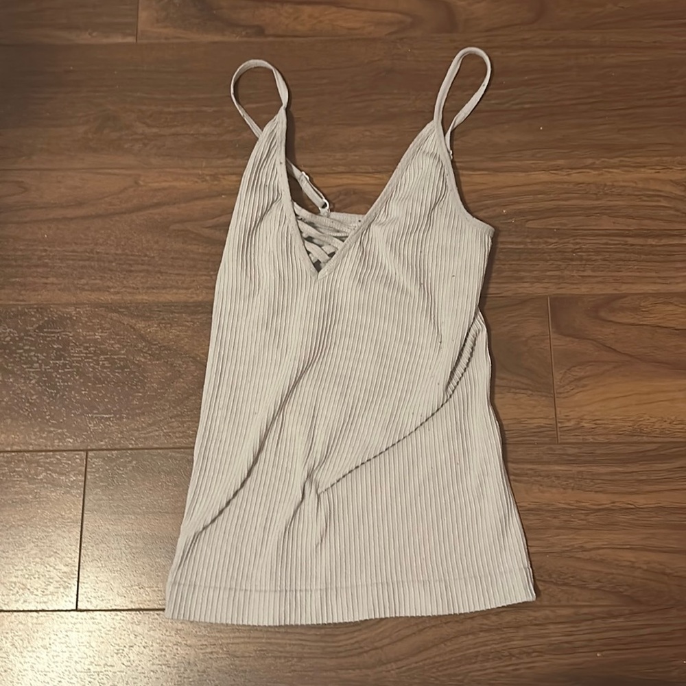 Unsure of brand (unreadable), white tank top, unsure of material, used